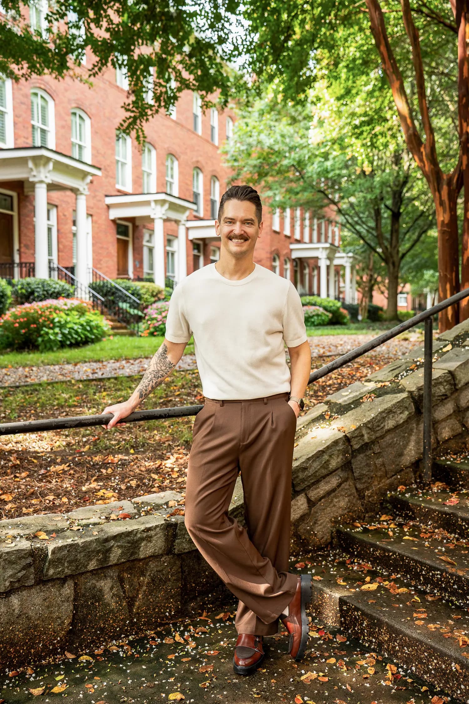 Cory Klose, gay Realtor in Atlanta, outside an intown brownstone